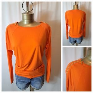 Michael Kors Long Sleeve Orange Top With Gold Zippers Down Shoulders and Arms